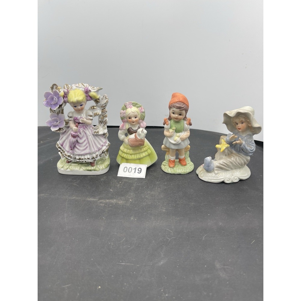 Four vintage children‎ figurines